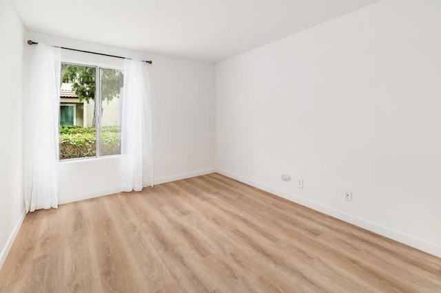 13754 Mango Dr Unit 111, Del Mar, CA 92014 - empty room featuring light wood-type flooring and baseboards