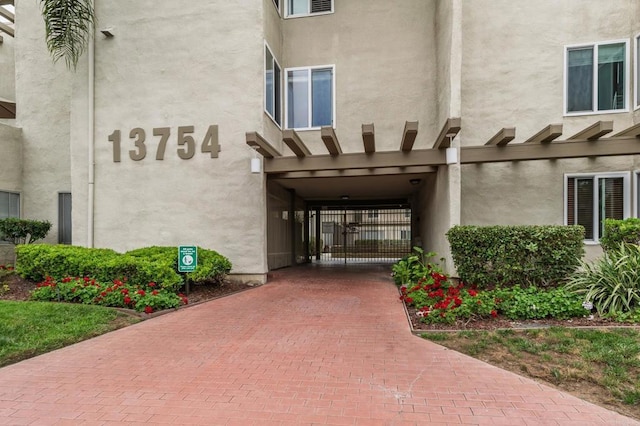 13754 Mango Dr Unit 111, Del Mar, CA 92014 - doorway to property featuring stucco siding