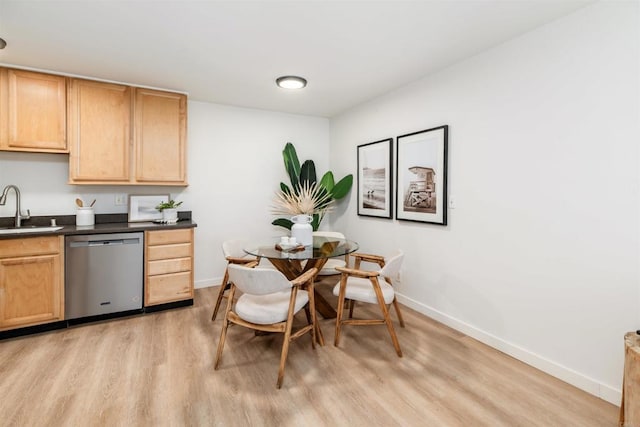 13754 Mango Dr Unit 111, Del Mar, CA 92014 - dining space with light wood-style floors and baseboards