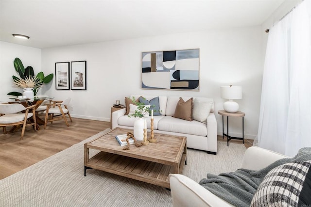 13754 Mango Dr Unit 111, Del Mar, CA 92014 - living area with wood finished floors and baseboards