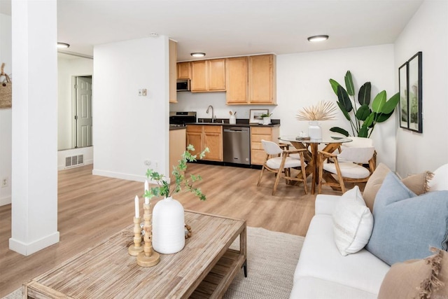 13754 Mango Dr Unit 111, Del Mar, CA 92014 - living room featuring light wood-type flooring and baseboards