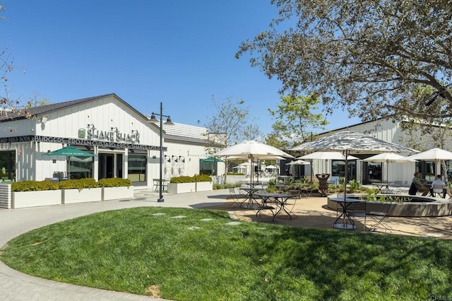 13754 Mango Dr Unit 111, Del Mar, CA 92014 - back of property featuring a lawn and a patio area