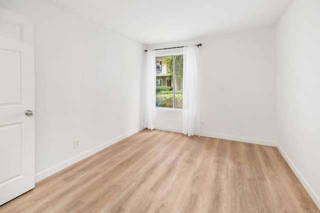 13754 Mango Dr Unit 111, Del Mar, CA 92014 - spare room featuring light wood finished floors and baseboards