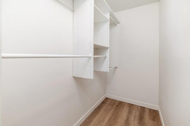 13754 Mango Dr Unit 111, Del Mar, CA 92014 - spacious closet featuring wood finished floors