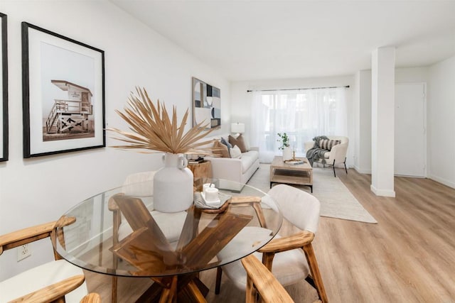 13754 Mango Dr Unit 111, Del Mar, CA 92014 - dining space featuring light wood-type flooring and baseboards