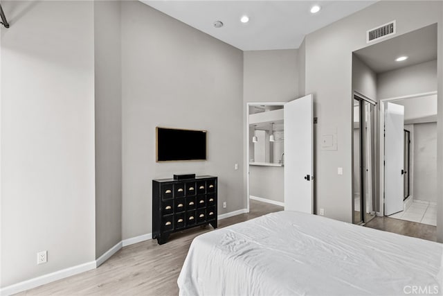 5151 Balboa Blvd Unit 303, Encino, CA 91316 - bedroom with wood finished floors, recessed lighting, and ensuite bath
