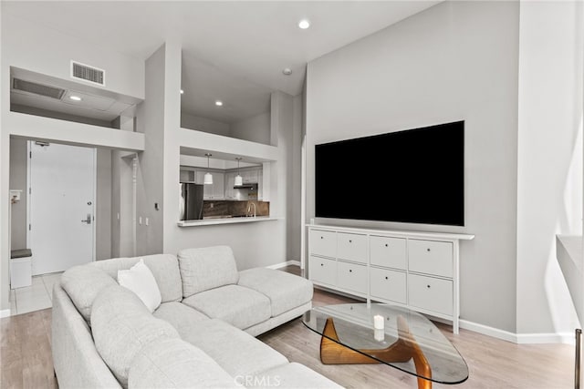 5151 Balboa Blvd Unit 303, Encino, CA 91316 - living area featuring light wood-type flooring and recessed lighting
