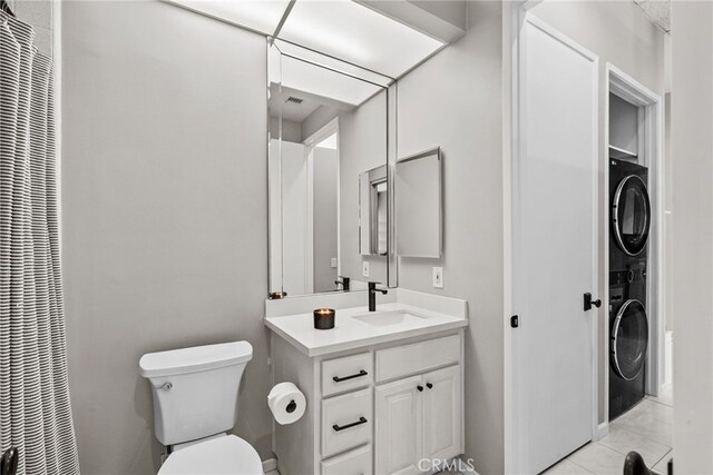 5151 Balboa Blvd Unit 303, Encino, CA 91316 - bathroom featuring stacked washer and clothes dryer, a heating unit, and vanity
