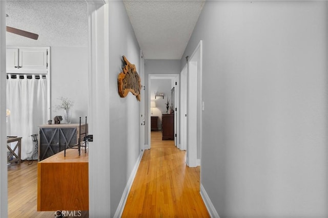 708 S Vecino Dr, Glendora, CA 91740 - hallway with light wood-type flooring and a textured ceiling