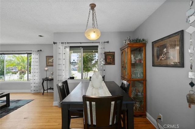 708 S Vecino Dr, Glendora, CA 91740 - dining area with a textured ceiling, healthy amount of natural light, and wood finished floors