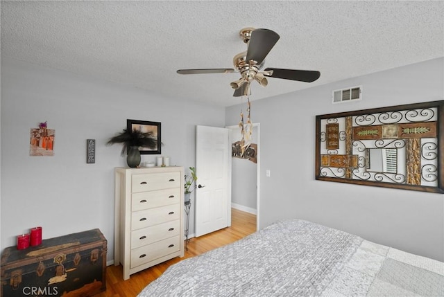 708 S Vecino Dr, Glendora, CA 91740 - bedroom with wood finished floors, a textured ceiling, and a ceiling fan