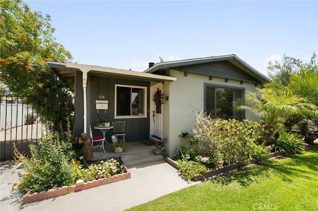 708 S Vecino Dr, Glendora, CA 91740 - view of front of property with board and batten siding, stucco siding, and a porch