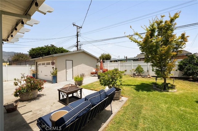 708 S Vecino Dr, Glendora, CA 91740 - fenced yard featuring a fire pit, an outdoor structure, a patio, driveway, and a detached garage