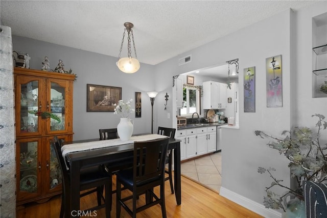 708 S Vecino Dr, Glendora, CA 91740 - dining space featuring light wood finished floors and a textured ceiling