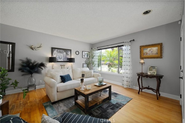 708 S Vecino Dr, Glendora, CA 91740 - living room featuring light wood finished floors and a textured ceiling