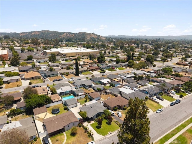 708 S Vecino Dr, Glendora, CA 91740 - aerial overview of property's location with a mountain backdrop and nearby suburban area