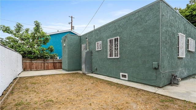 4348 Lima St, Los Angeles, CA 90011 - rear view of property featuring a patio area and stucco siding