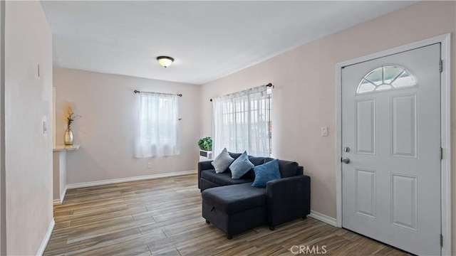 4348 Lima St, Los Angeles, CA 90011 - foyer entrance featuring plenty of natural light and wood finished floors