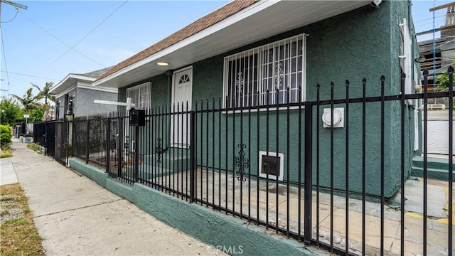 4348 Lima St, Los Angeles, CA 90011 - view of front of property featuring a fenced front yard and stucco siding