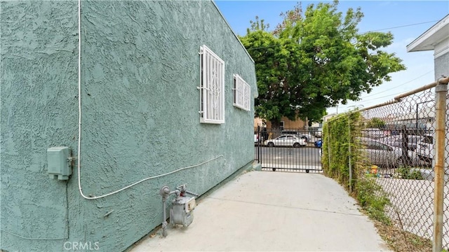 4348 Lima St, Los Angeles, CA 90011 - view of property exterior featuring stucco siding and a gate
