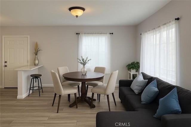 4348 Lima St, Los Angeles, CA 90011 - dining space with light wood-type flooring and baseboards