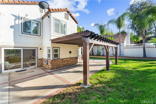 25 Westbrook Ln, Pomona, CA 91766 - back of house featuring stucco siding, a patio area, a pergola, stone siding, and a tile roof