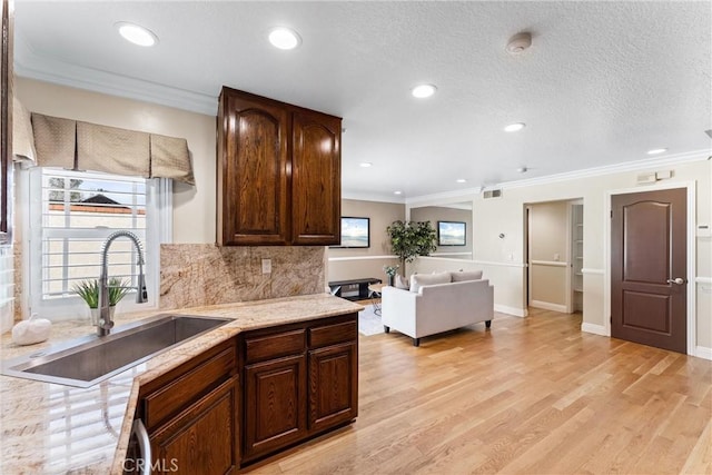 25 Westbrook Ln, Pomona, CA 91766 - kitchen featuring decorative backsplash, recessed lighting, light wood-type flooring, ornamental molding, and dark brown cabinetry