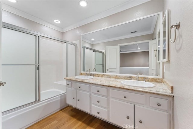25 Westbrook Ln, Pomona, CA 91766 - full bathroom featuring ornamental molding, double vanity, wood finished floors, shower / bath combination with glass door, and recessed lighting