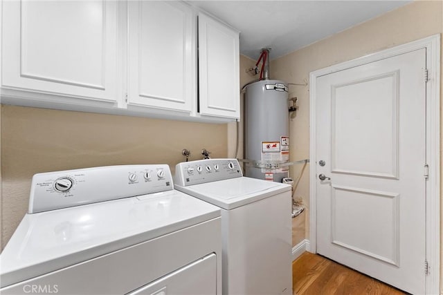 25 Westbrook Ln, Pomona, CA 91766 - laundry area featuring strapped water heater, independent washer and dryer, light wood-type flooring, and cabinet space
