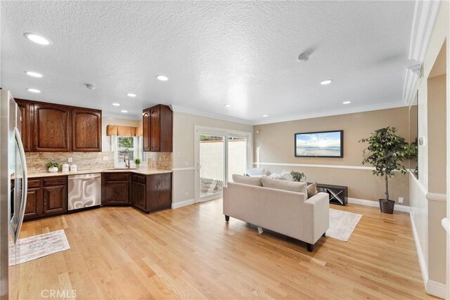 25 Westbrook Ln, Pomona, CA 91766 - living area with light wood finished floors, a textured ceiling, recessed lighting, and ornamental molding