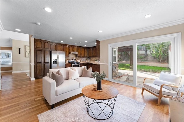 25 Westbrook Ln, Pomona, CA 91766 - living room featuring recessed lighting, crown molding, light wood finished floors, and a textured ceiling