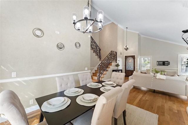 25 Westbrook Ln, Pomona, CA 91766 - dining room with a chandelier, stairs, wood finished floors, high vaulted ceiling, and ornamental molding
