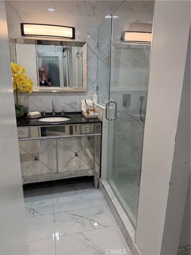 237 E 57th St, Long Beach, CA 90805 - bathroom featuring marble finish floors, a stall shower, and vanity