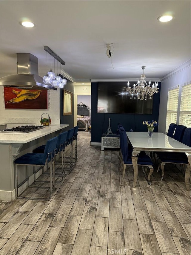 237 E 57th St, Long Beach, CA 90805 - dining space with crown molding, wood finished floors, a chandelier, and recessed lighting