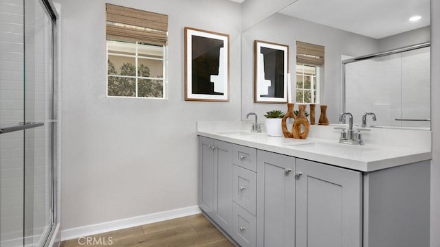 29159 Victoria Beach Blvd, Winchester, CA 92596 - bathroom featuring a stall shower, wood finished floors, double vanity, and recessed lighting