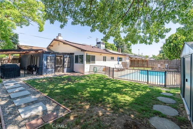 2427 Ceanothus Ave, Chico, CA 95926 - back of house with a fenced backyard, a patio area, and stucco siding