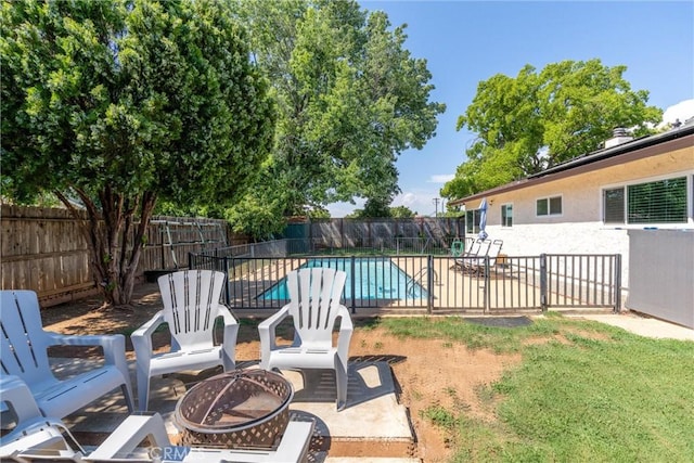 2427 Ceanothus Ave, Chico, CA 95926 - fenced backyard featuring a fire pit and a patio area