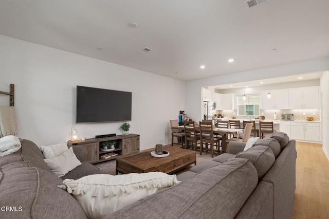 751 Winchester Dr, Oxnard, CA 93036 - living room featuring light wood-style flooring and recessed lighting