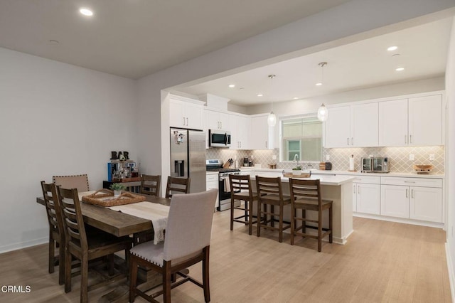 751 Winchester Dr, Oxnard, CA 93036 - dining room with light wood finished floors and recessed lighting