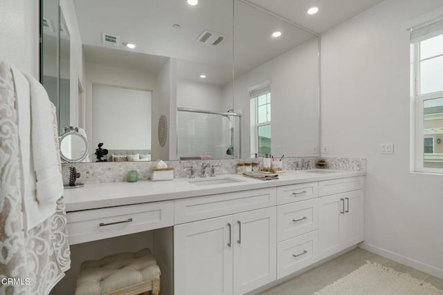 751 Winchester Dr, Oxnard, CA 93036 - full bath featuring double vanity, a stall shower, healthy amount of natural light, recessed lighting, and tile patterned flooring