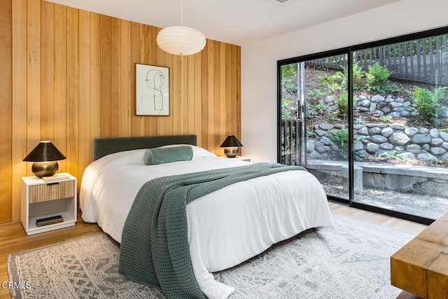 808 Inverness Dr, La Canada Flintridge, CA 91011 - bedroom with wood finished floors, wood walls, and access to exterior