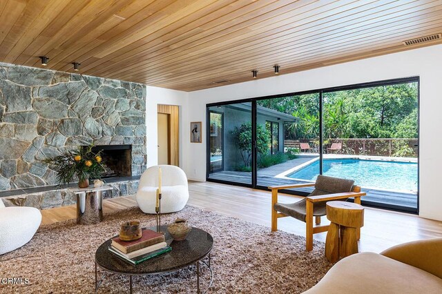 808 Inverness Dr, La Canada Flintridge, CA 91011 - living room featuring healthy amount of natural light, wood finished floors, a fireplace, and wood ceiling