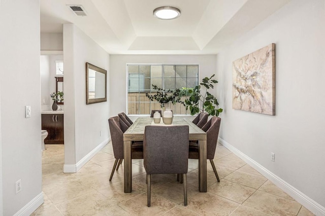 14136 Capewood Ln, San Diego, CA 92128 - dining room featuring a raised ceiling, plenty of natural light, and light tile patterned floors