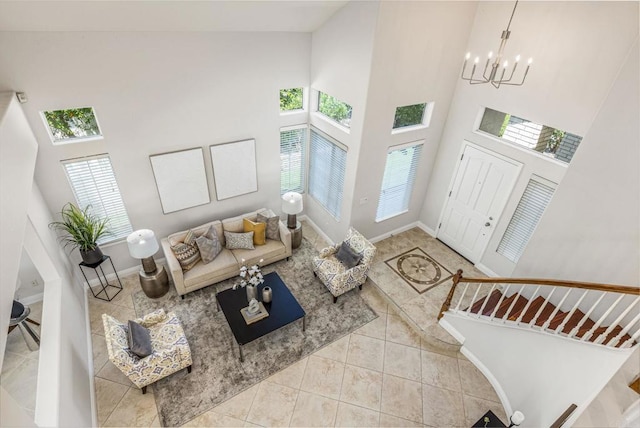 14136 Capewood Ln, San Diego, CA 92128 - tiled living room with a high ceiling and a chandelier