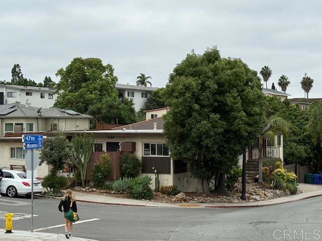 4496 47th St, San Diego, CA 92115 - view of asphalt street with sidewalks, curbs, and traffic signs
