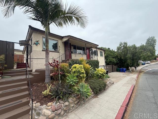 4496 47th St, San Diego, CA 92115 - view of property exterior with stucco siding