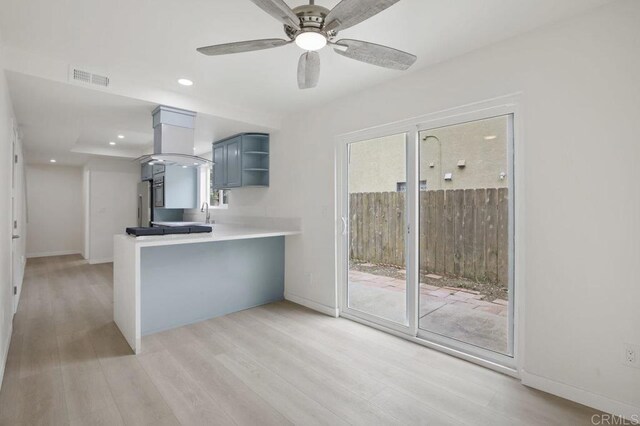 814 Hollister St Unit B, Otay Mesa, CA 92154 - kitchen featuring island range hood, light wood-type flooring, healthy amount of natural light, open shelves, and recessed lighting