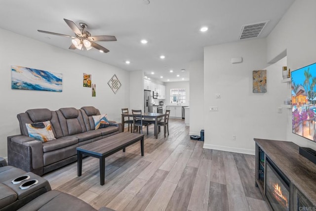 4376 Pacifica Dr Unit 2, Oceanside, CA 92056 - living area with light wood-style floors, ceiling fan, and recessed lighting