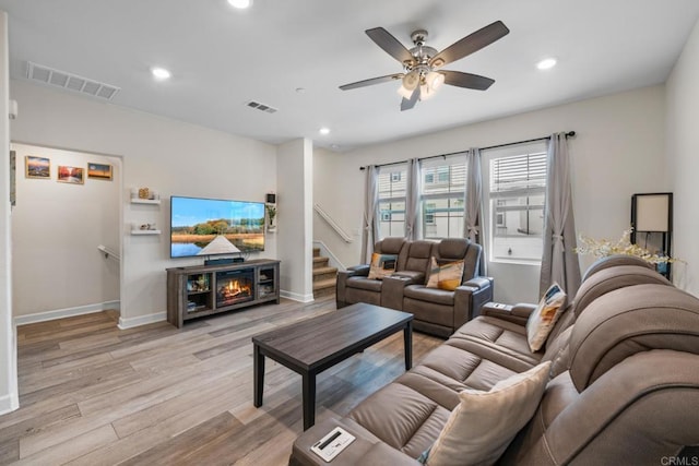 4376 Pacifica Dr Unit 2, Oceanside, CA 92056 - living room with light wood finished floors, recessed lighting, a ceiling fan, and a fireplace
