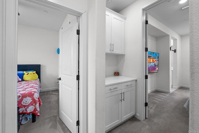 4376 Pacifica Dr Unit 2, Oceanside, CA 92056 - hallway featuring carpet and baseboards